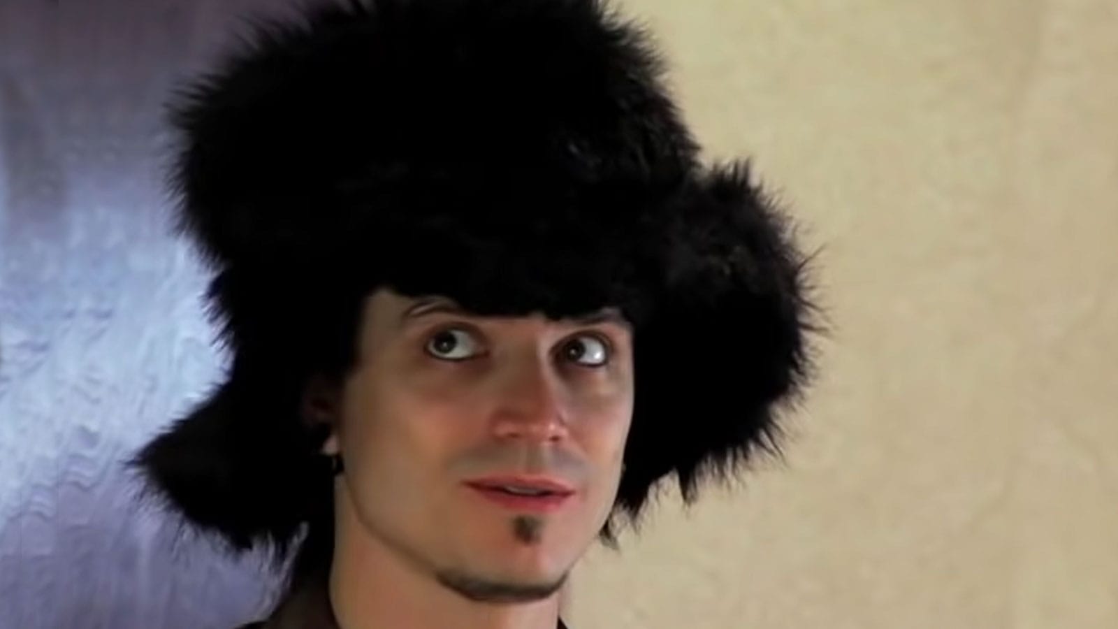 "Pick-Up Artist" Mystery giving YouTube advice in a black fur hat, dark eyeliner, soul patch and sneaky expression