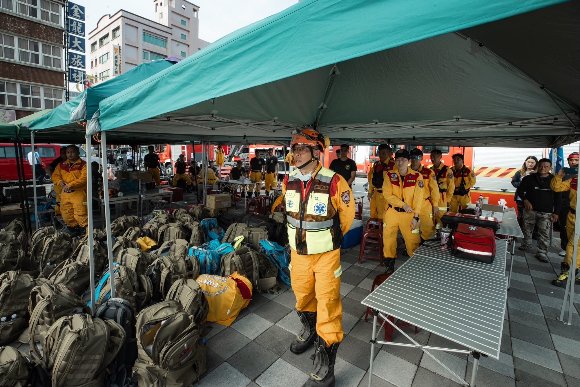 A tent filled with yellow-clad rescue workers in Hualien, Taiwan, after the earthquake April 3, 2024