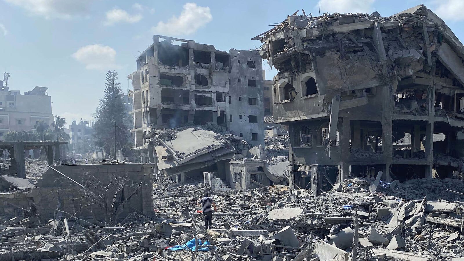 Palestinians inspect the damage following an Israeli airstrike on the El-Remal aera in Gaza City on October 9, 2023
