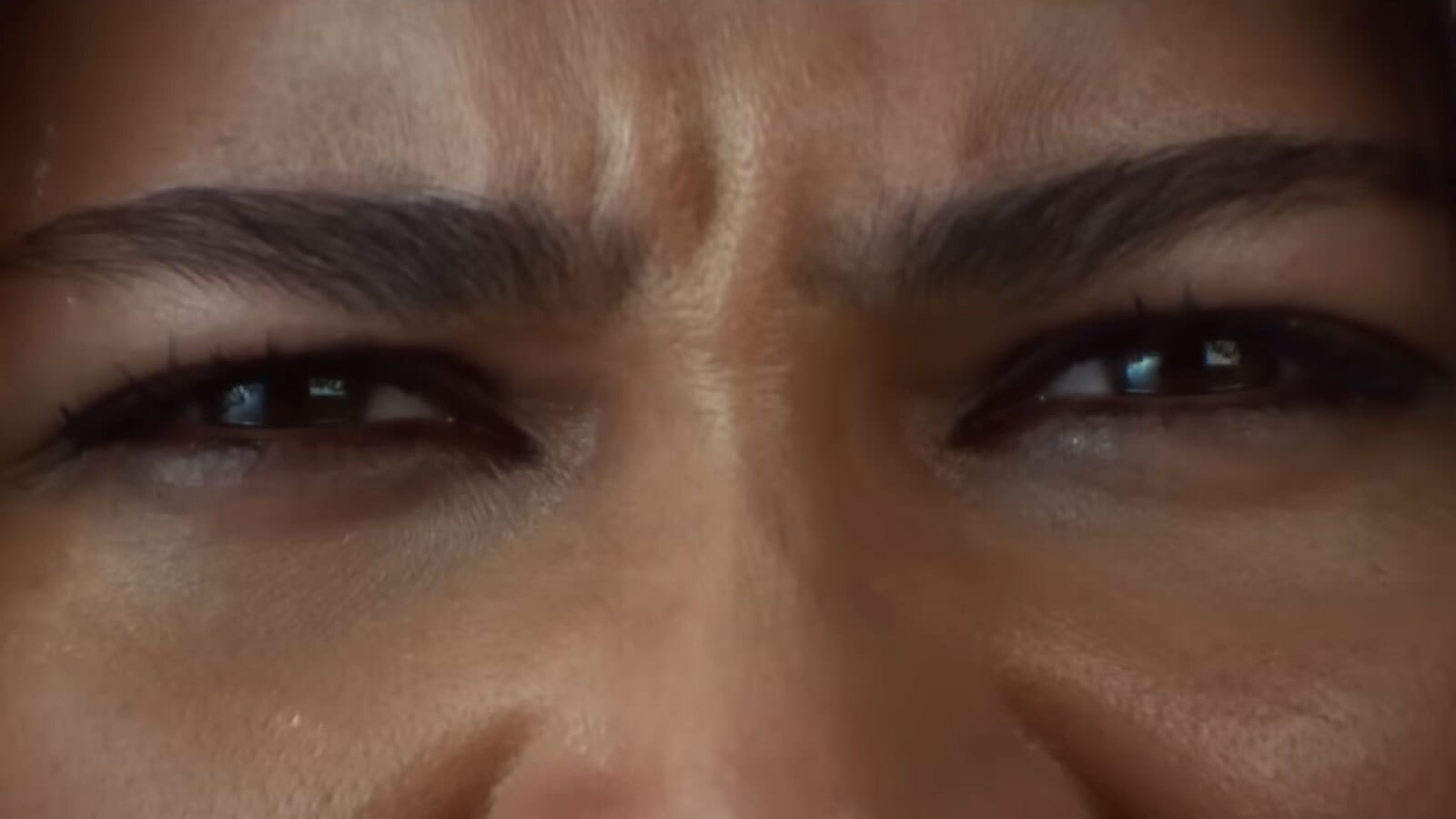close up on zendaya’s fierce eyes, which are squinted in concentration. Her eyebrows are furrowed. 
