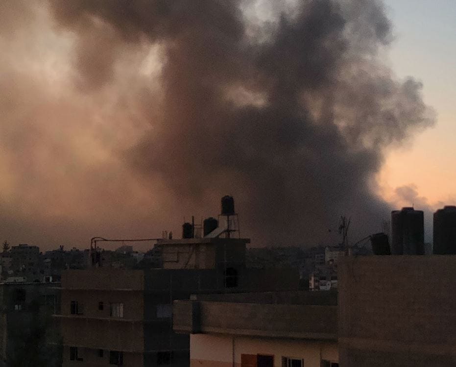 October 7th, 2024, from Moh Telbani's place in north Gaza: a cityscape, and above it a hellish red sky full of smoke and war