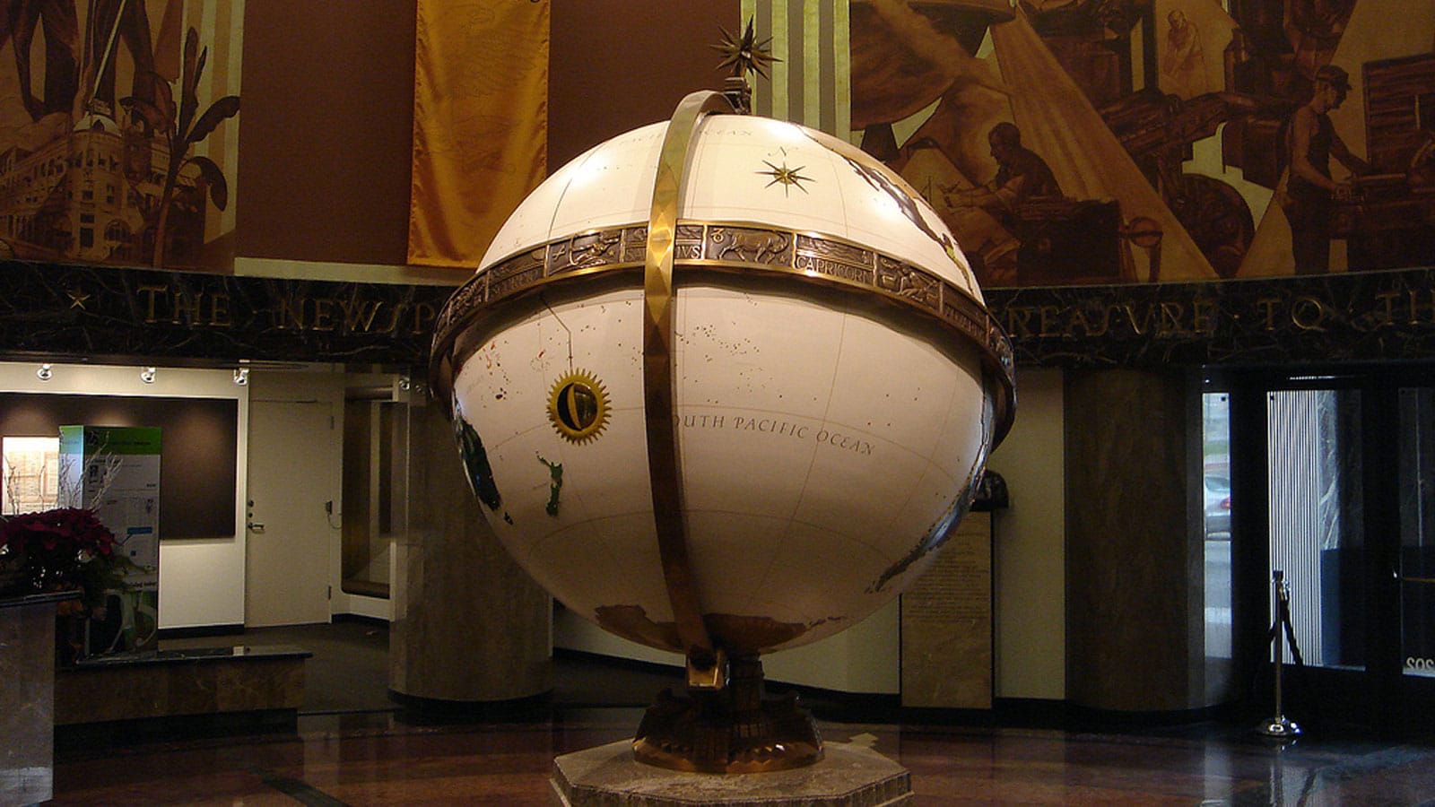 The giant aluminum globe in the lobby of the LA Times building downtown, Hugo Ballin murals in the background; 1930s visions of peace and prosperity