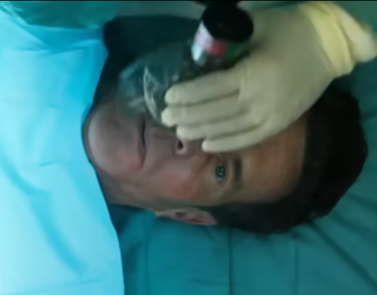 Screenshot from the film 'Reagan' showing Dennis Quaid as the 40th president in the hospital, just after he was shot in an assassination attempt in 1981