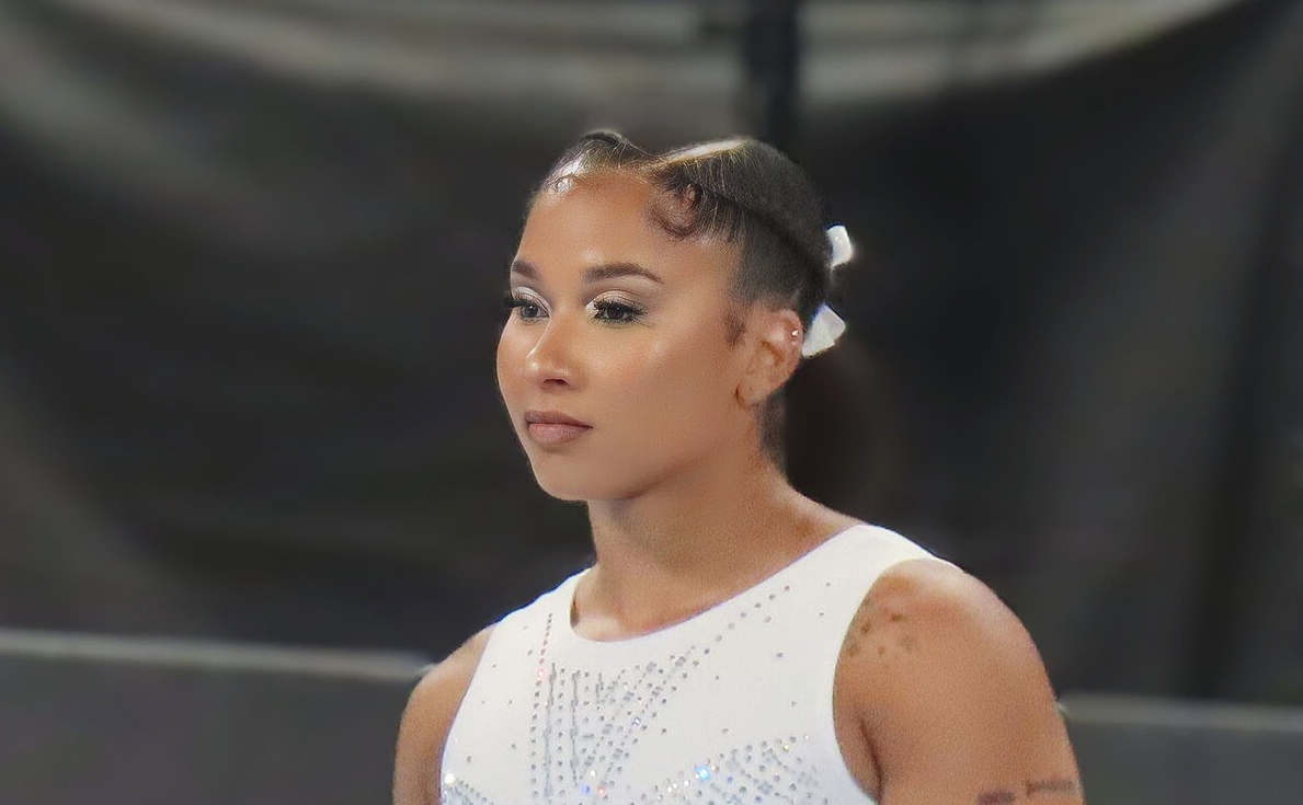 Jordan Chiles, 2024 U.S. National Championships in gymnastics, in a spangled white leotard and a pensive expression