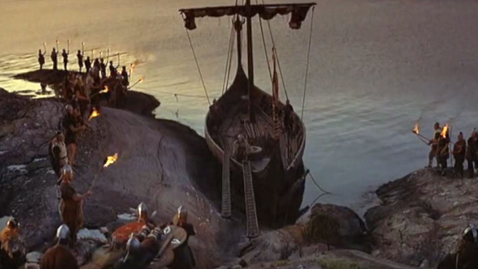 Hollywood Vikings of 1958 preparing to send fallen hero Kurt Douglas's funerary boat alight