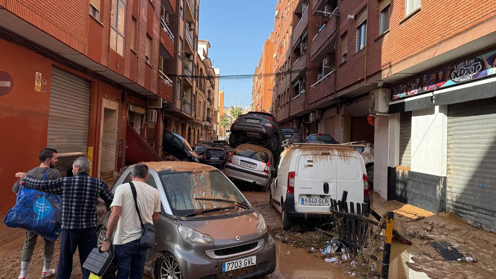 Catastrophic flooding with cars stacked atop one another in a narrow street in Catarroja, Valencia, October 2024