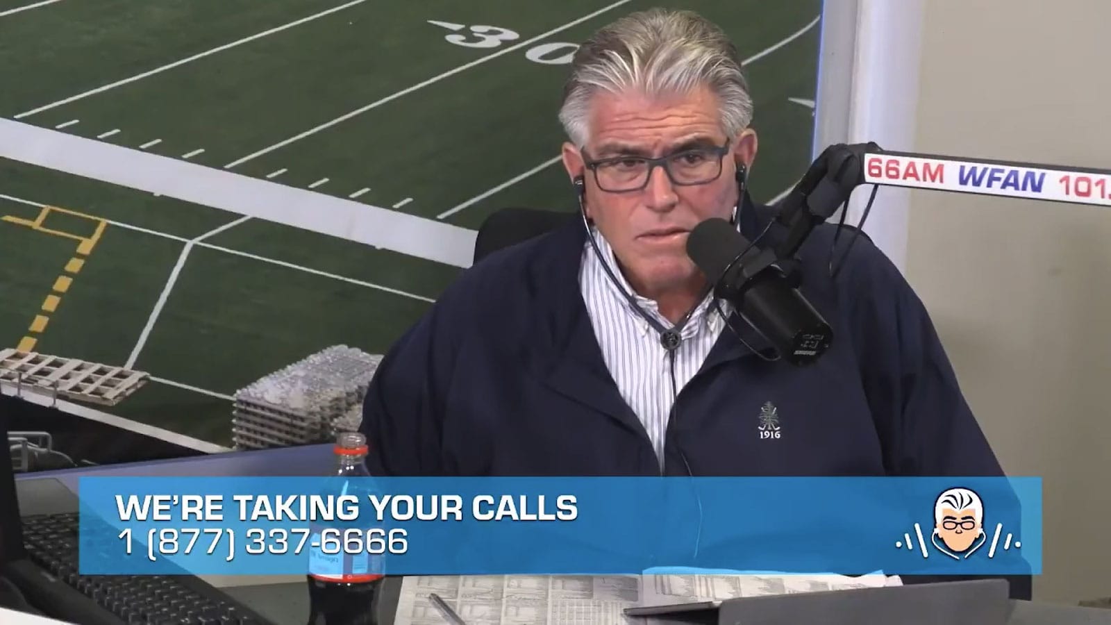 Mike Francesca in a WFAN studio, the image of a football field behind him, and the caption, "WE'RE TAKING YOUR CALLS'