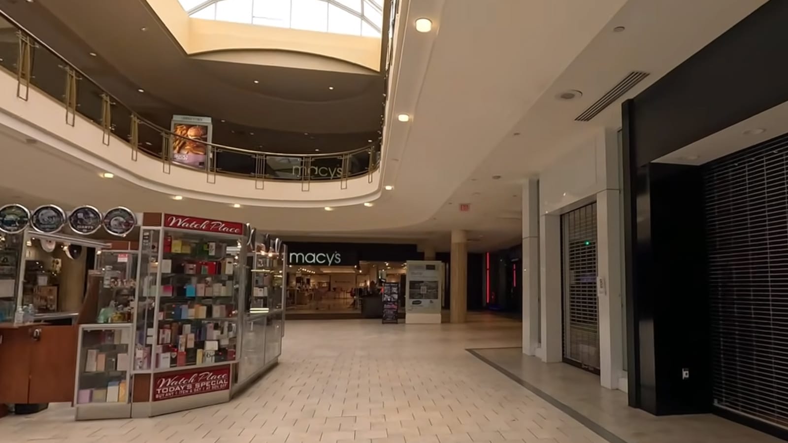 Interior of Livingston Mall, New Jersey, with peachy light in the atrium and a Macy's at the end of a long hallway