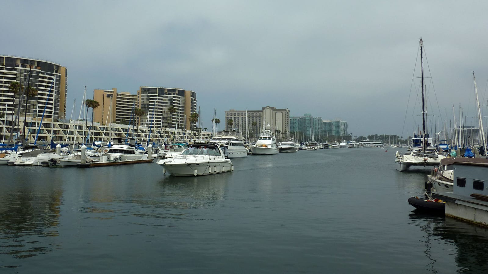 The marina at Marina del Rey in Los Angeles, looking south toward Palos Verdes, with speedboats and sailboats and iconic buildings