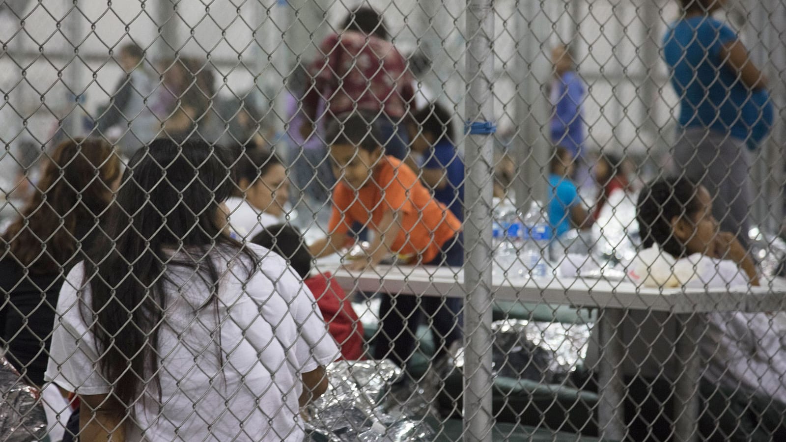 Official image from U.S. Customs and Border Patrol of people (including children) in cages